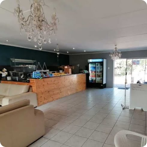 Modern and welcoming café-style waiting area at Zogs Swim School, featuring comfortable seating and refreshments.